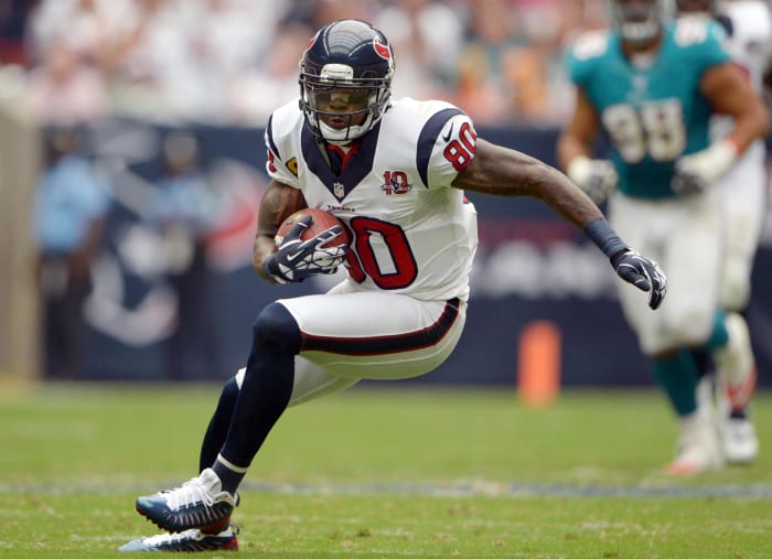 Texans receiver Andre Johnson (80) catches a pass against the Miami Dolphins at Reliant Stadium. The Texans defeated the Dolphins 30-10.